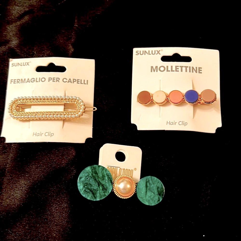 NWOT Very cute Hair Clips purchased in boutique/Europe/multicolored & designs
